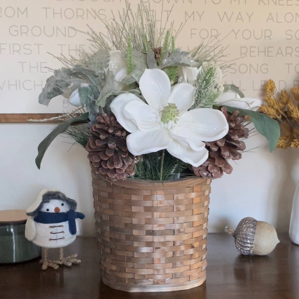 Winter hanging basket floral decor pinecones white flowers pine needles wreath